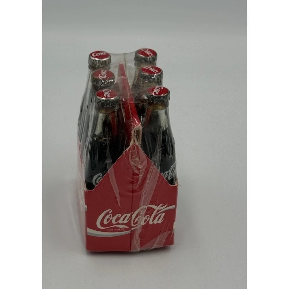 Vintage Miniature Six Pack of Glass Coca Cola Bottles In Paper Carrier Sealed